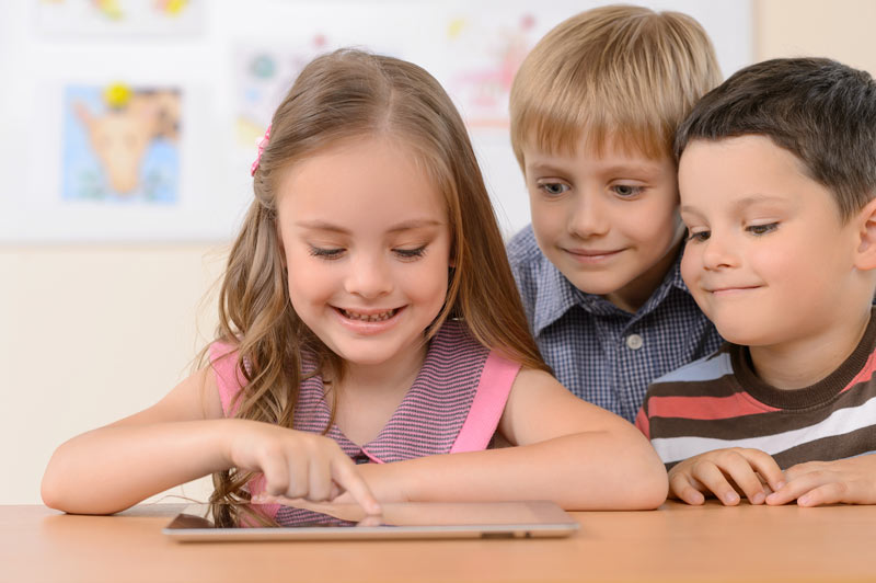 Children looking at iPad